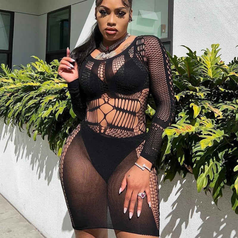 Woman models a sexy solid color cutout dress with long sleeves, showcasing bold modern design, figure-flattering silhouette, and effortless confidence.