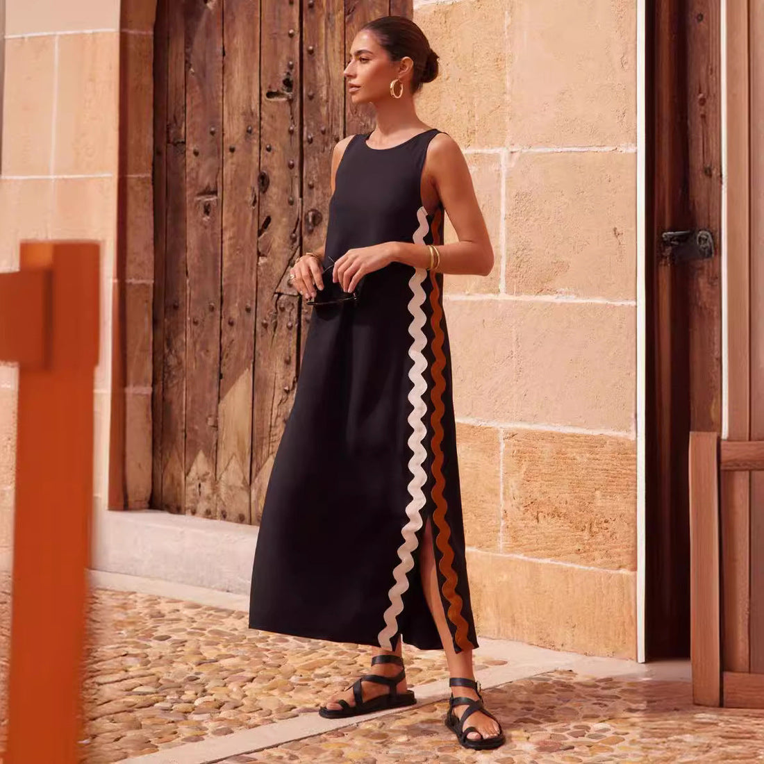 Woman in a white mid-length lace dress, dancing at an outdoor festival, styled with boots and statement festival accessories, glowing in sunlight.