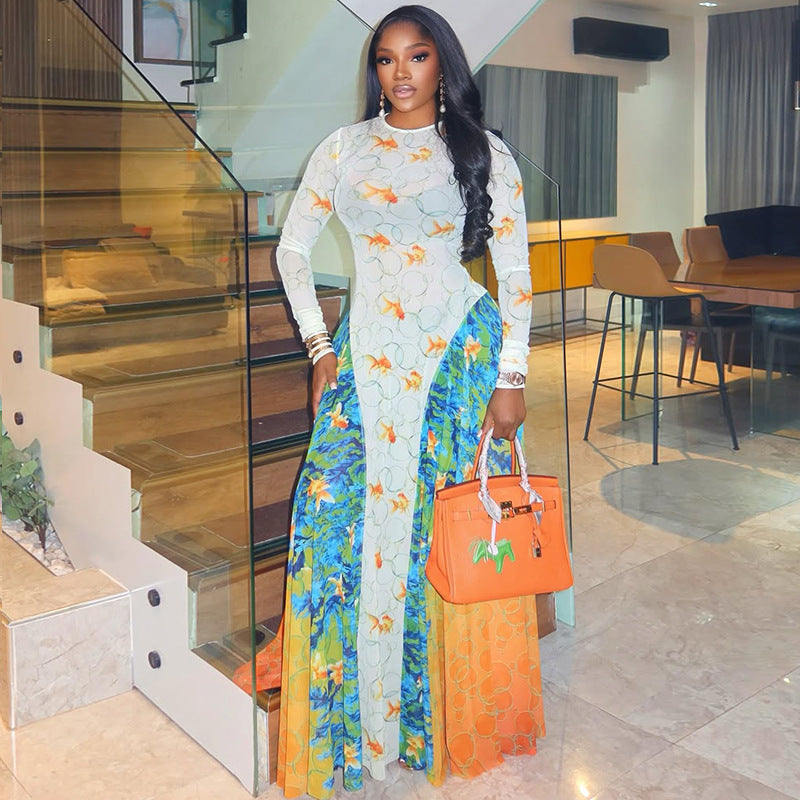 ALT: Woman in a bold printed A-line dress with round neck and long sleeves, styled with boots and chunky accessories, radiating fierce festival energy.