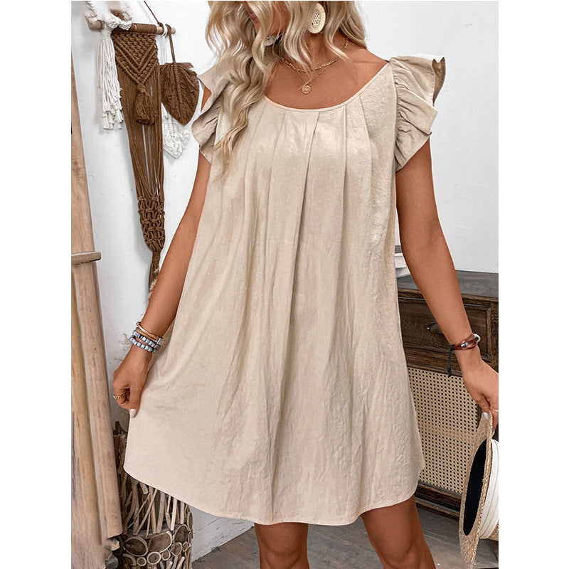 Robe mi-longue unie à col rond et volants, idéale pour l'été.