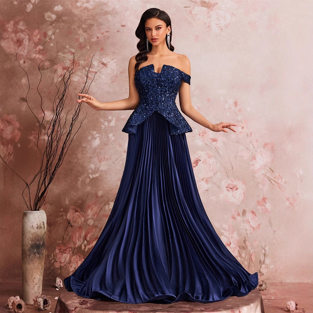 Robe élégante à sequins et coupe bandeau asymétrique, idéale pour cocktail, dîner ou demoiselle d'honneur.