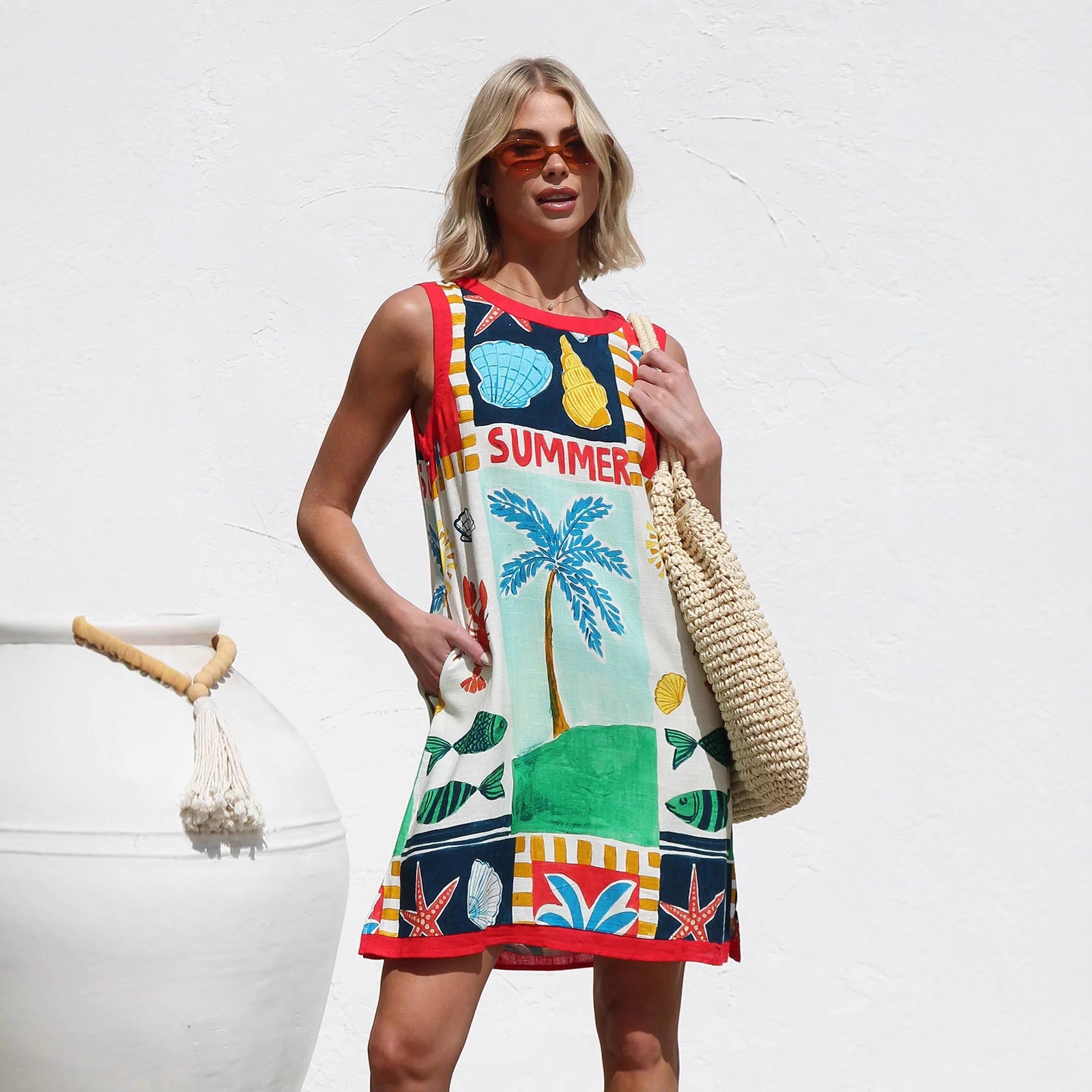 Robe sans manches imprimée multicolore à positionnement de la robe